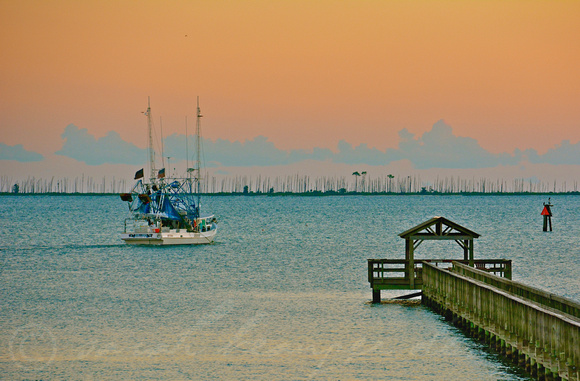 Gulf Oaks pier and the "Mark & Dawn" with Deer Island in the background (the end that burned) on Fro