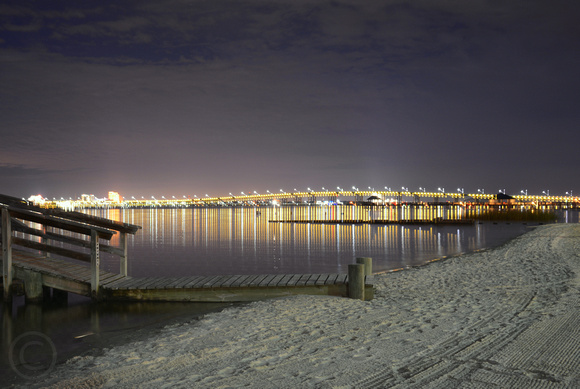 Biloxi/Ocean Springs bridge reflection at night on Front Beach